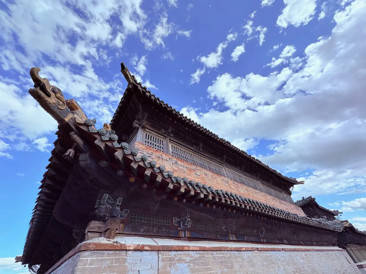 Carved eaves and dragon-head beam ends of a temple at Erdene Zuu
